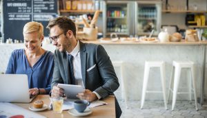 Young Business People Working at Cafe