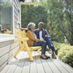 elderly couple in retirement sitting on porch