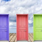 3 colorful doors with sky background